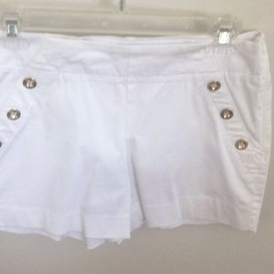 White brass button shorts